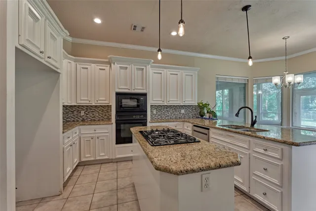 a view of a big room with windows and chandelier