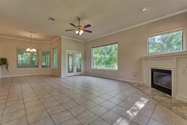 a view of a grassy field with trees