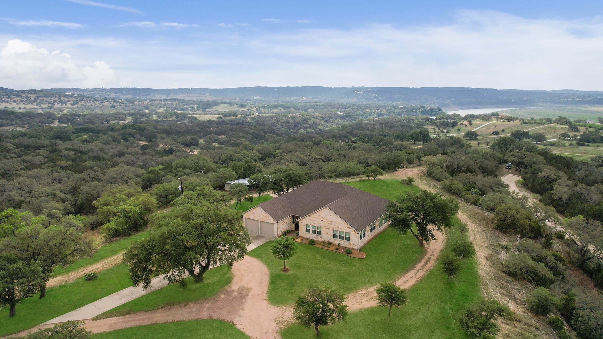 28701 Valley Road Marble Falls, TX 78654 - Photo 2 of 35 an aerial view of a house with a garden