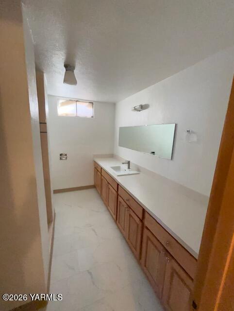 1662 South Euclid Road Grandview, WA 98930 - Photo 12 of 15 a spacious bathroom with a double vanity sink and a mirror