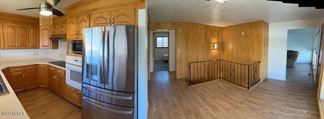 1662 South Euclid Road Grandview, WA 98930 - Photo 5 of 15 a view of a hallway with wooden floor and furniture