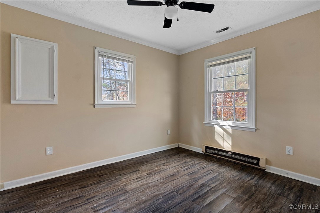 975 Windyknight Road Montpelier, VA 23192 - Photo 16 of 38 Spare room with ornamental molding, dark hardwood