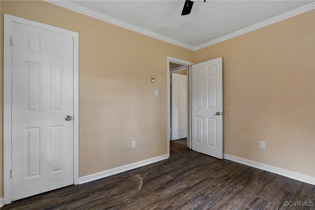 975 Windyknight Road Montpelier, VA 23192 - Photo 17 of 38 Spare room with ceiling fan, dark hardwood / wood-