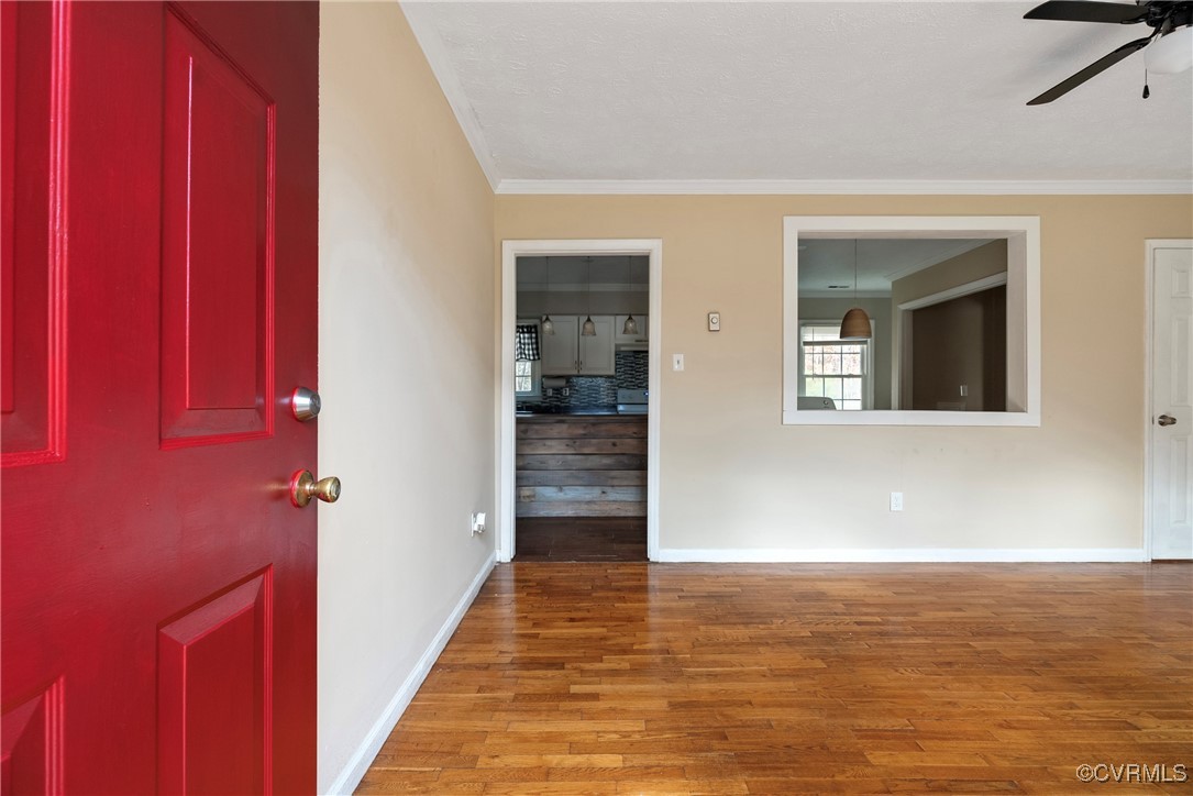 975 Windyknight Road Montpelier, VA 23192 - Photo 2 of 38 Foyer with ceiling fan, wood-type flooring, and cr