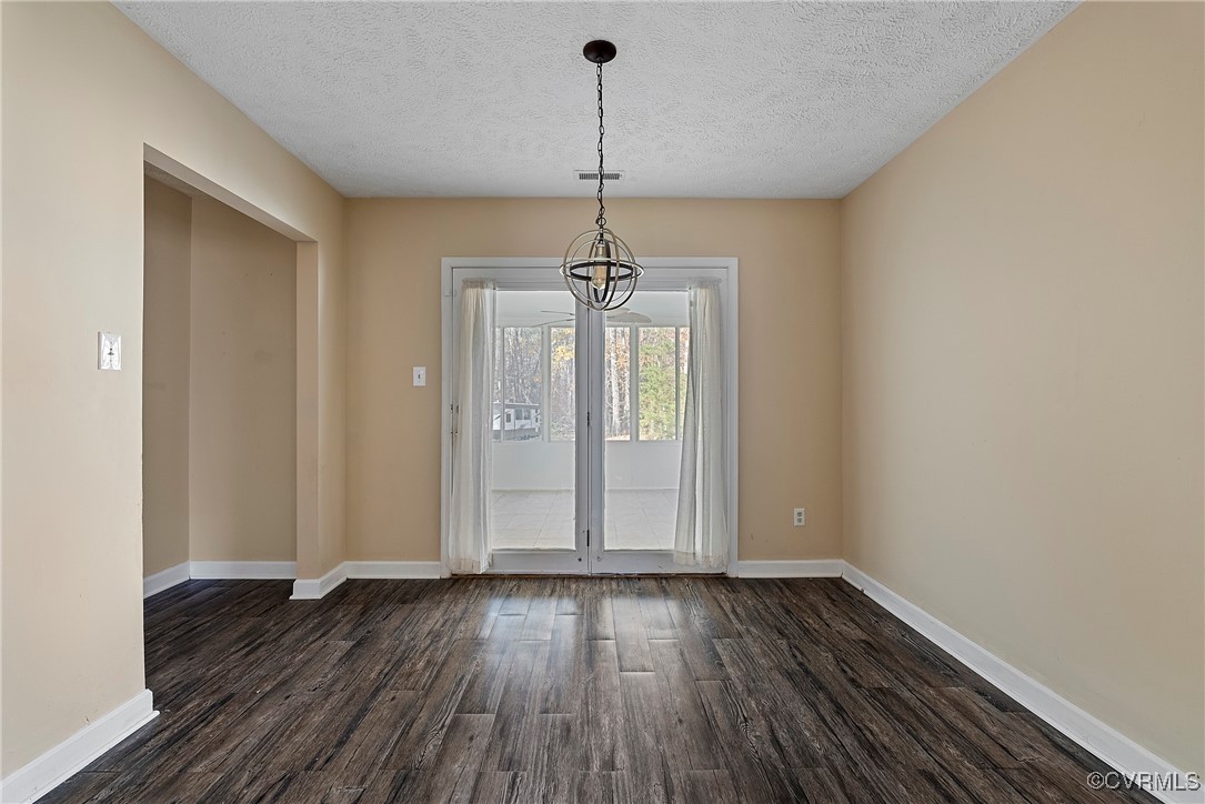 975 Windyknight Road Montpelier, VA 23192 - Photo 25 of 38 Unfurnished dining area with a textured ceiling, d