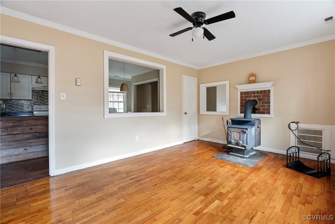 975 Windyknight Road Montpelier, VA 23192 - Photo 3 of 38 Living room featuring ceiling fan, wood-type floor