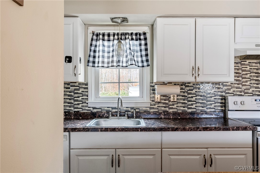 975 Windyknight Road Montpelier, VA 23192 - Photo 8 of 38 Kitchen with white range oven, white cabinetry, an