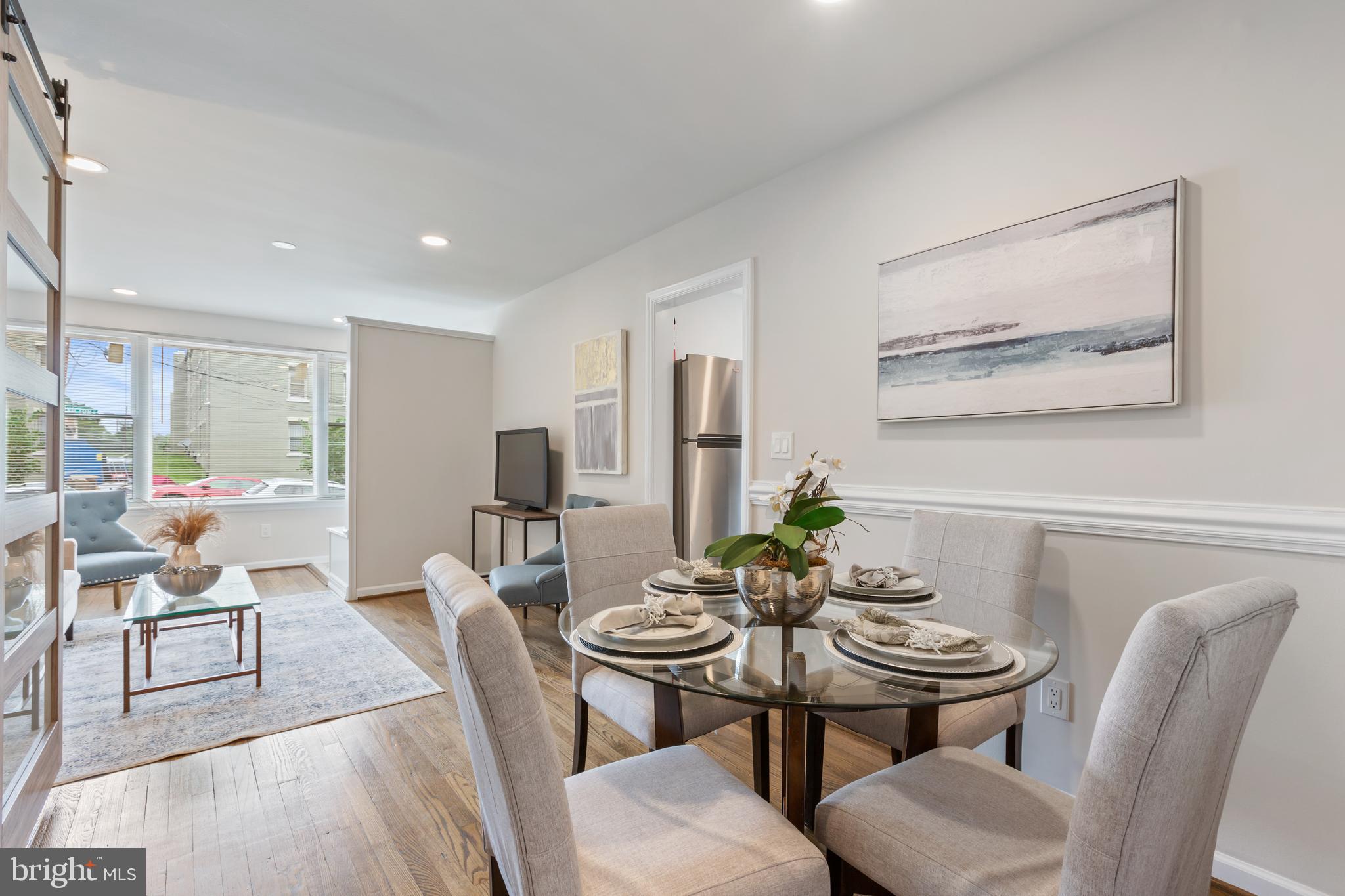 53 Victor Street Northeast, Unit 1 Washington, DC 20011 - Photo 7 of 18 a view of a dining room with furniture and wooden floor
