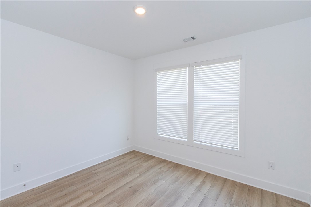 607 WH Kay Lane Anderson, SC 29621 - Photo 14 of 48 An airy bedroom with resilient wood flooring and ample natural illumination from large windows.