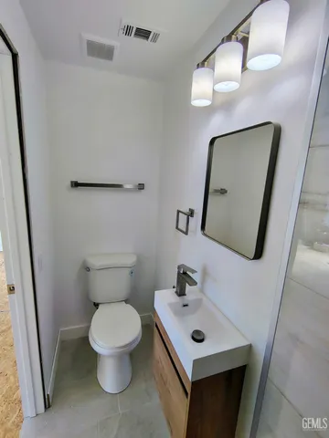 a bathroom with a sink a mirror and shower