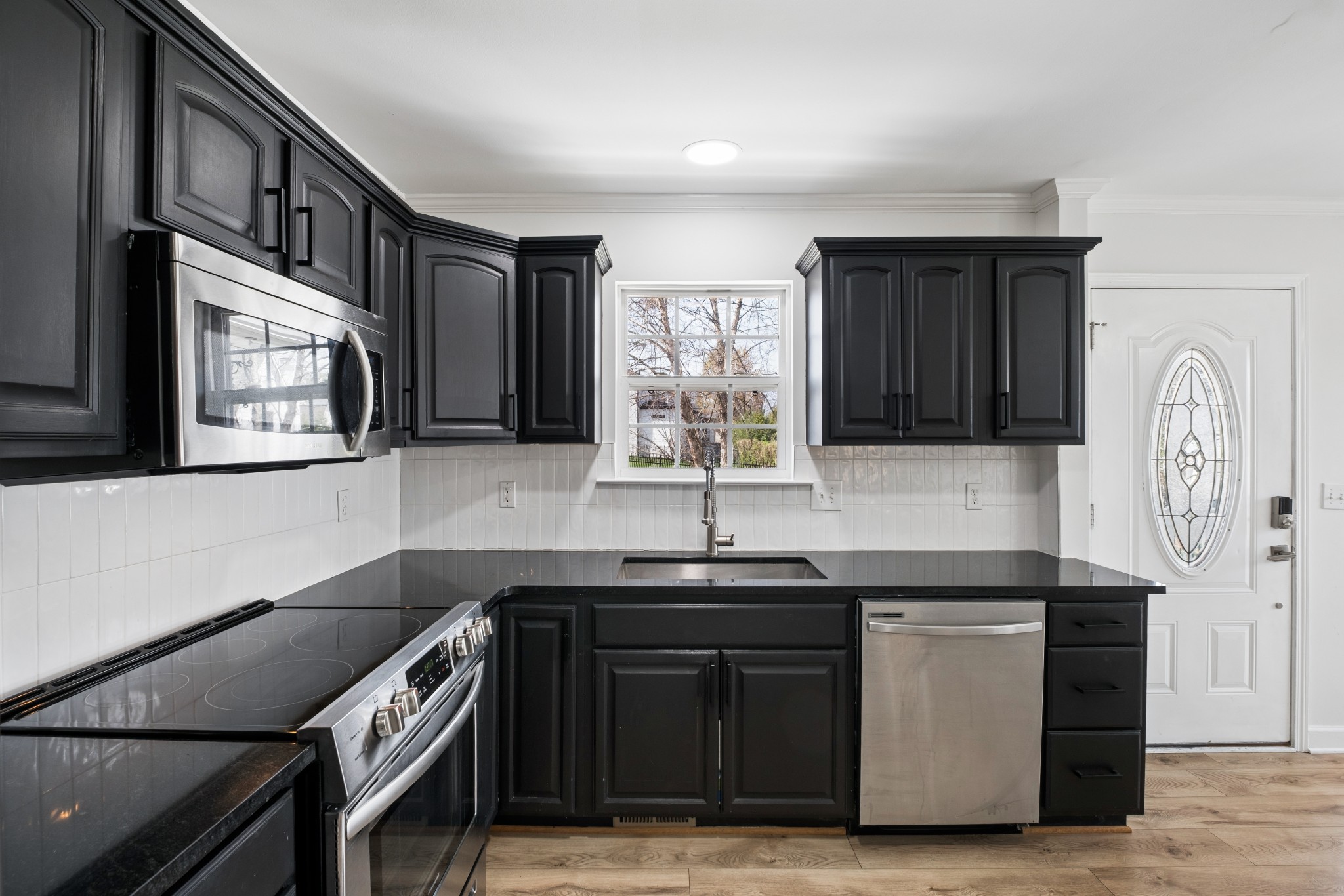 2418 Abbott Martin Road Nashville, TN 37215 - Photo 18 of 54 a kitchen with stainless steel appliances granite countertop a sink and a stove