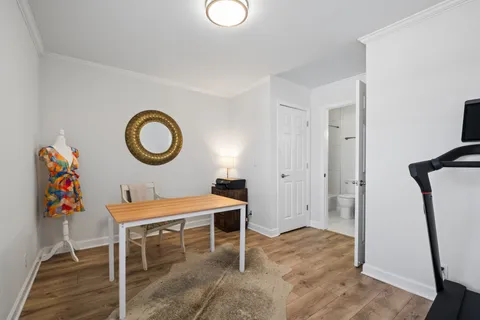 a view of a dining room with furniture and wooden floor