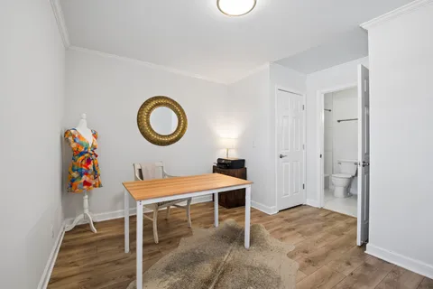 a dining room with a table and chairs
