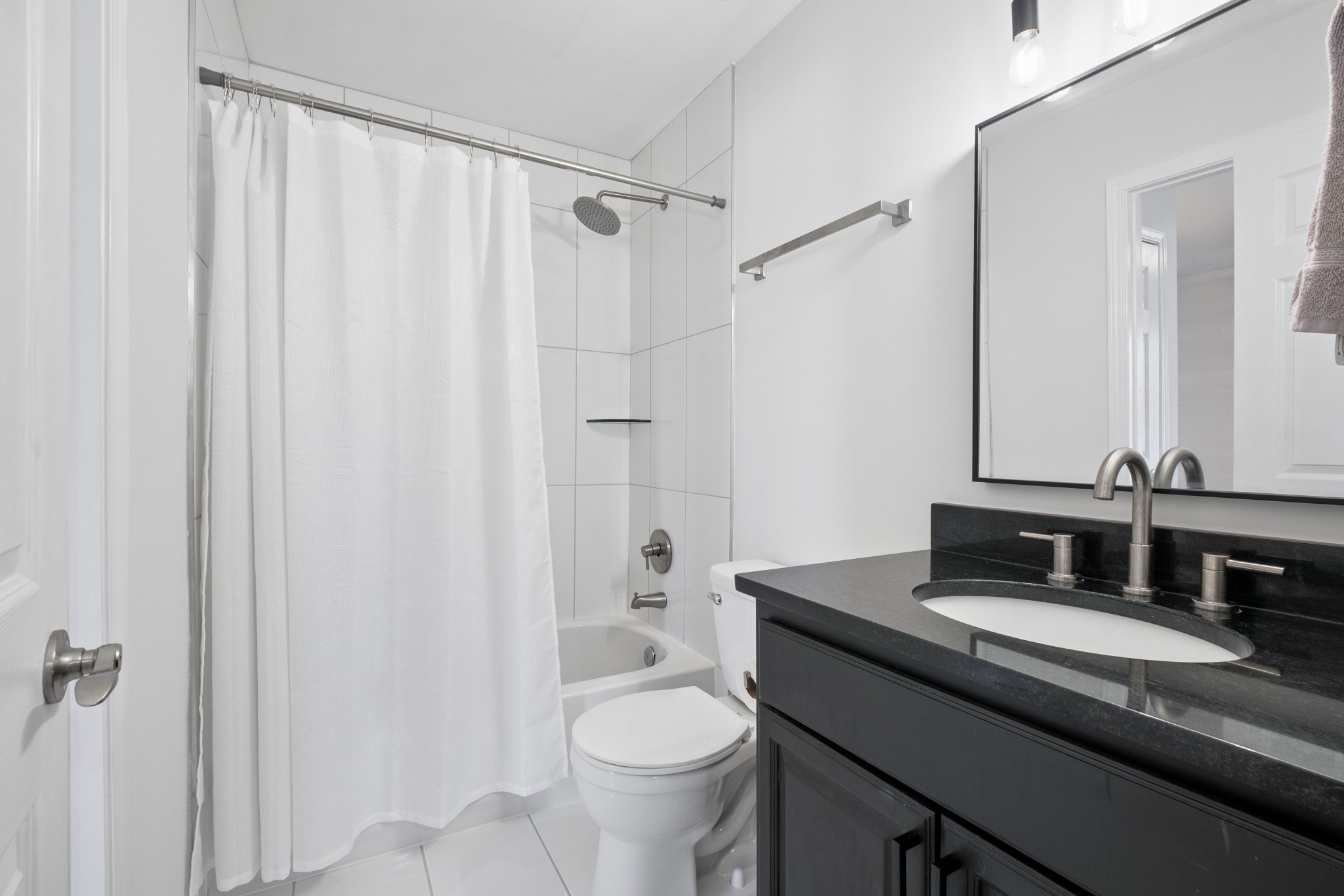 2418 Abbott Martin Road Nashville, TN 37215 - Photo 24 of 54 a bathroom with a granite countertop sink toilet and shower