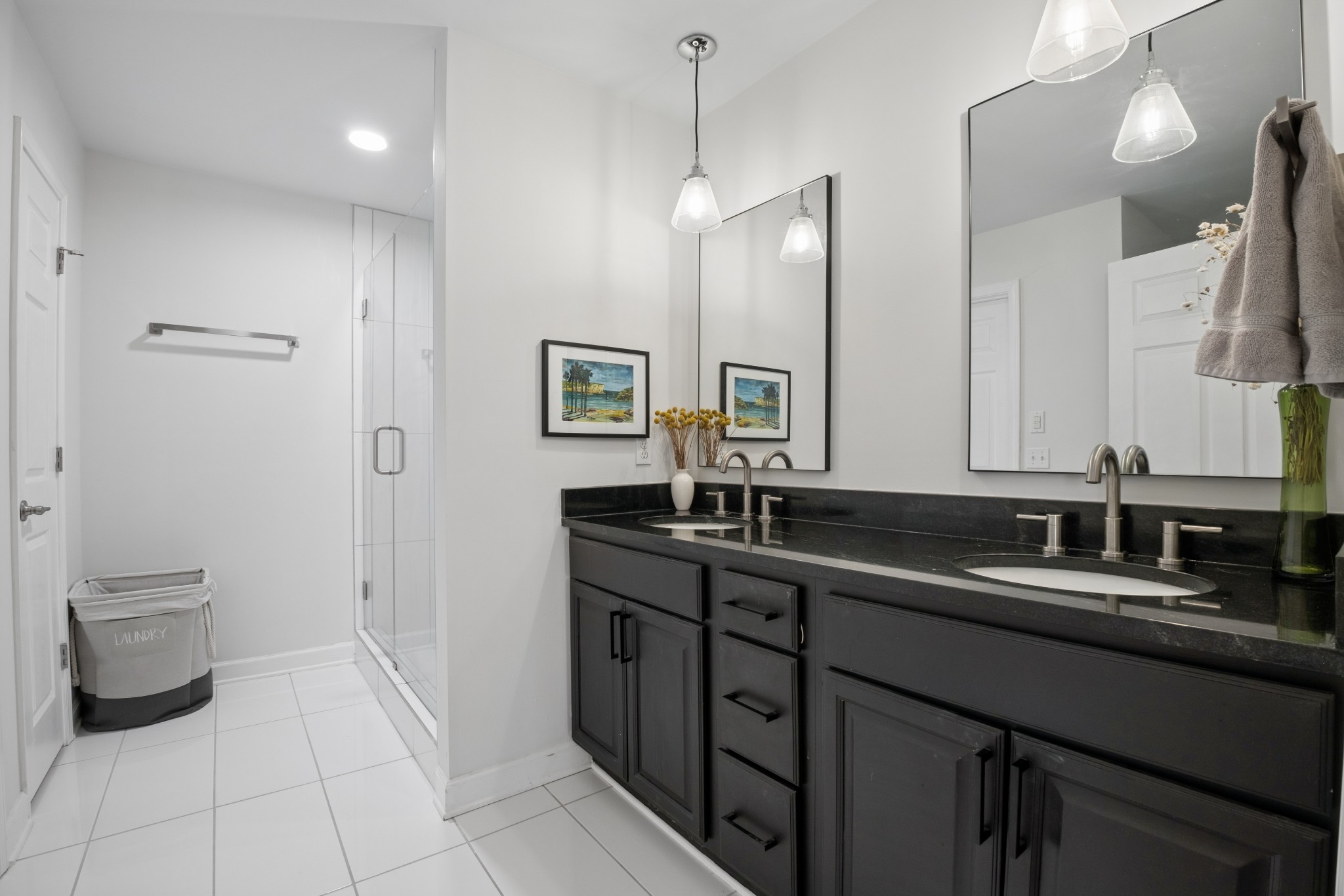 2418 Abbott Martin Road Nashville, TN 37215 - Photo 28 of 54 a bathroom with a double vanity sink a toilet and a mirror