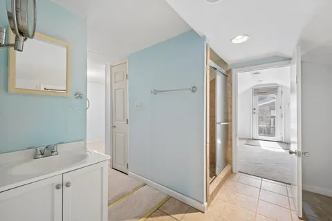 a bathroom with a sink and a mirror