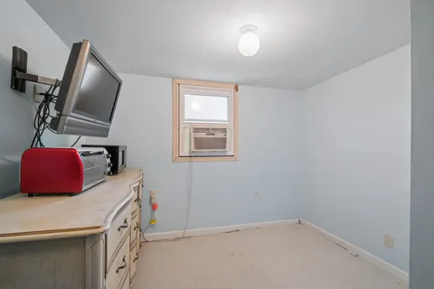 a room with a bed and furniture