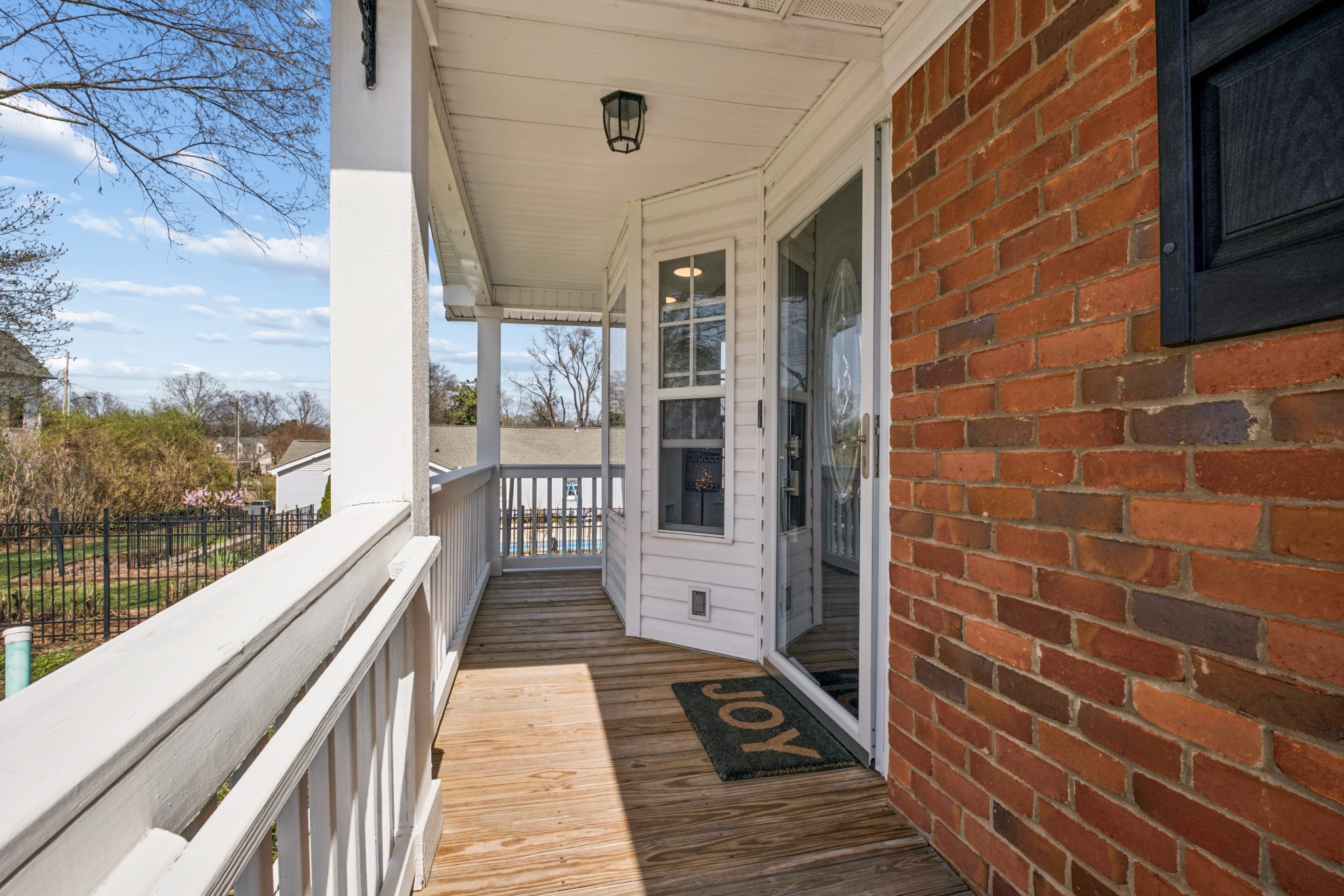 2418 Abbott Martin Road Nashville, TN 37215 - Photo 6 of 54 a view of a balcony with wooden floor and fence