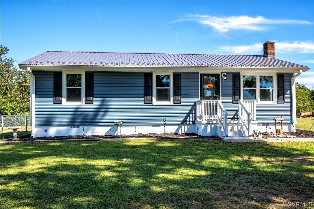 16907 Courthouse Road Dinwiddie, VA 23841 - Photo 1 of 15 a front view of a house with a yard