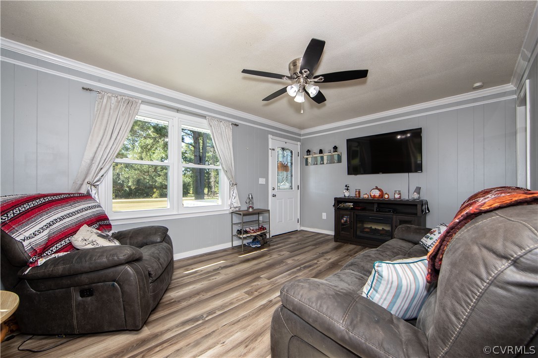 16907 Courthouse Road Dinwiddie, VA 23841 - Photo 11 of 15 a living room with furniture a flat screen tv and a window