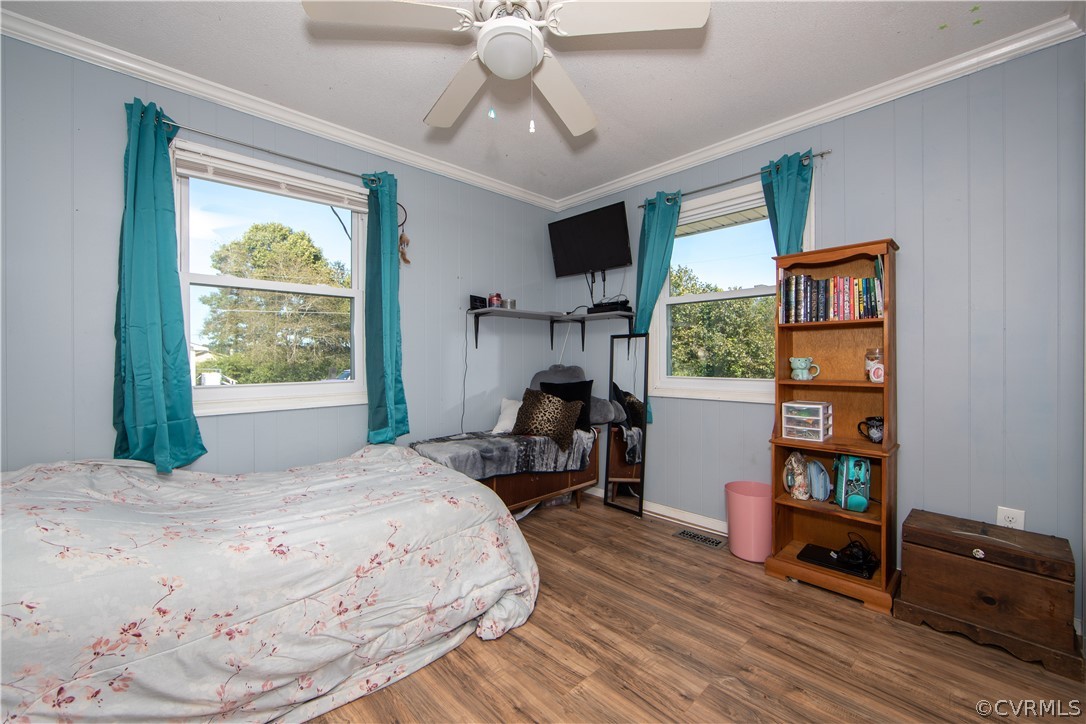 16907 Courthouse Road Dinwiddie, VA 23841 - Photo 13 of 15 a bedroom with a bed and a window