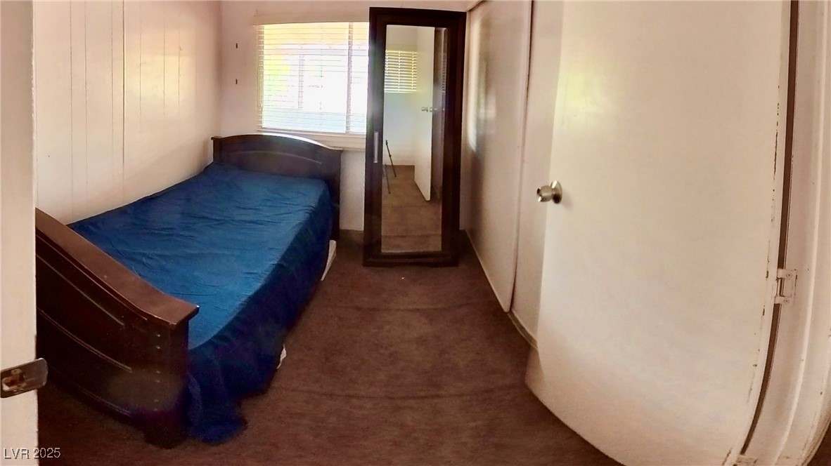 80 Russell Road Pahrump, NV 89048 - Photo 13 of 20 Bedroom featuring dark colored carpet
