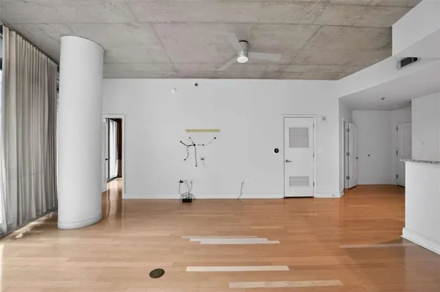 a view of a livingroom with wooden floor