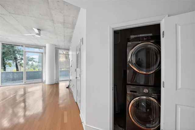 a view of a hallway with washer and dryer