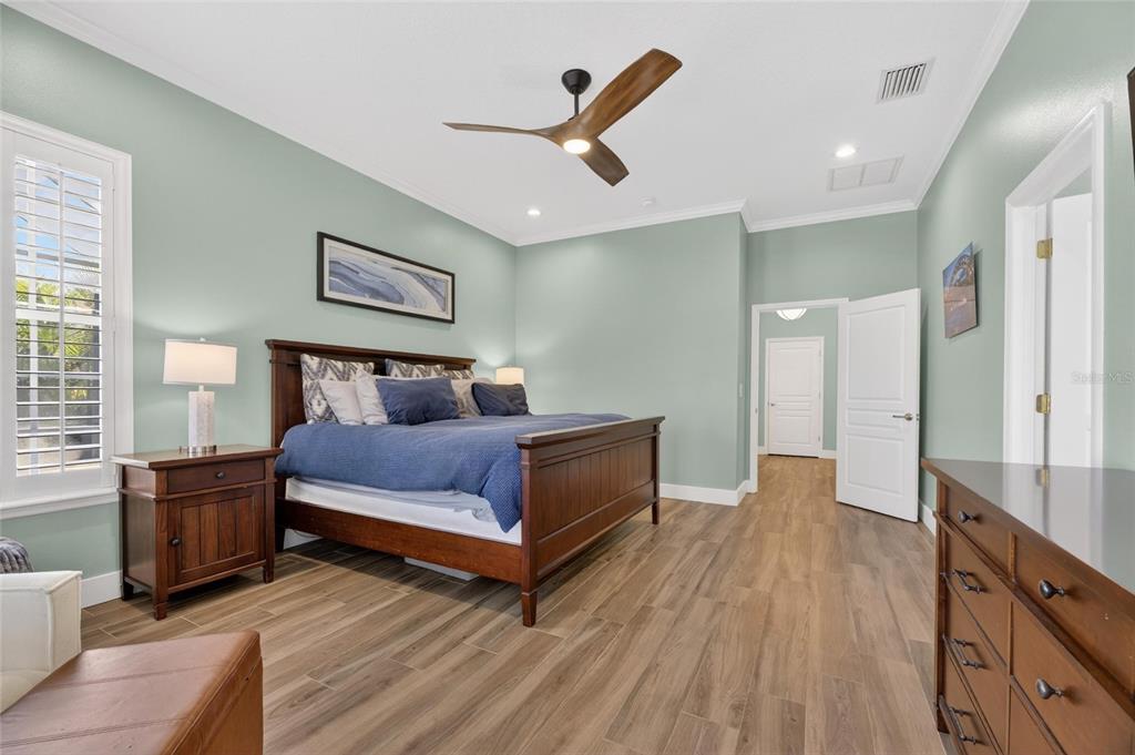 508 Islebay Drive Apollo Beach, FL 33572 - Photo 39 of 98 a bedroom with a bed and a flat screen tv