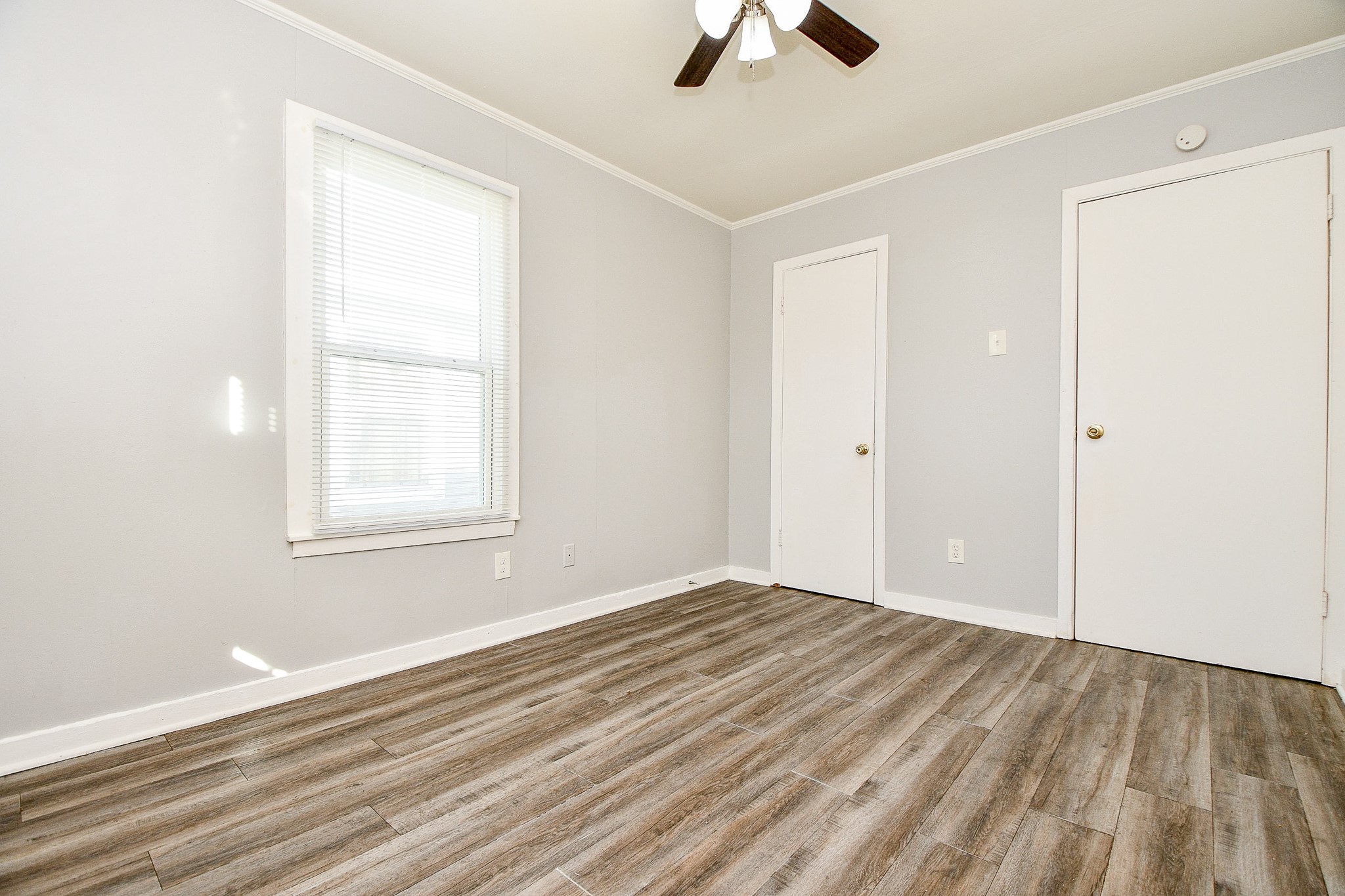 5000 Noble Street, Unit 6 Houston, TX 77020 - Photo 19 of 21 wooden floor in an empty room with a window