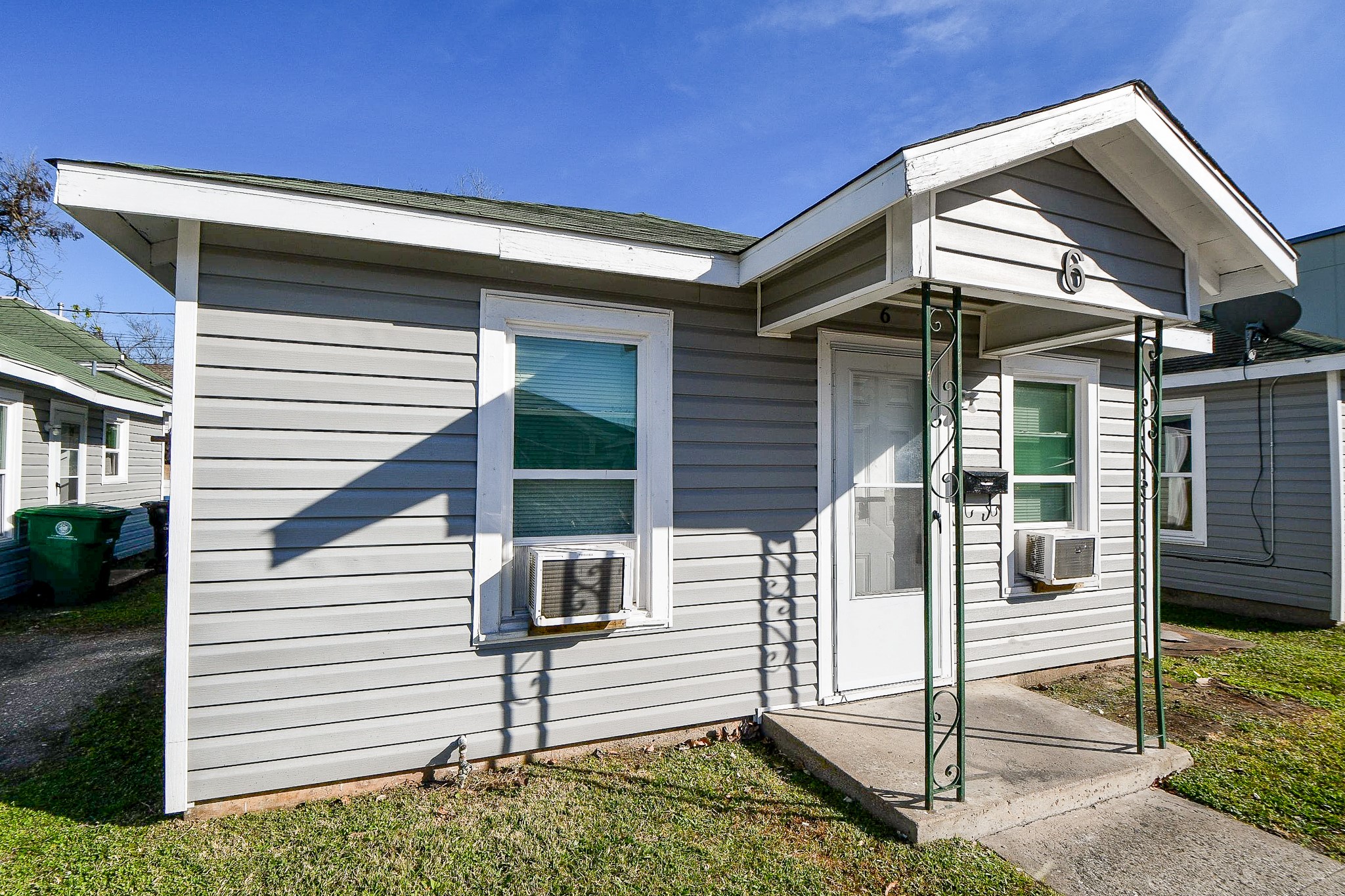5000 Noble Street, Unit 6 Houston, TX 77020 - Photo 2 of 21 a view of a white house with a small yard and wooden floor and fence
