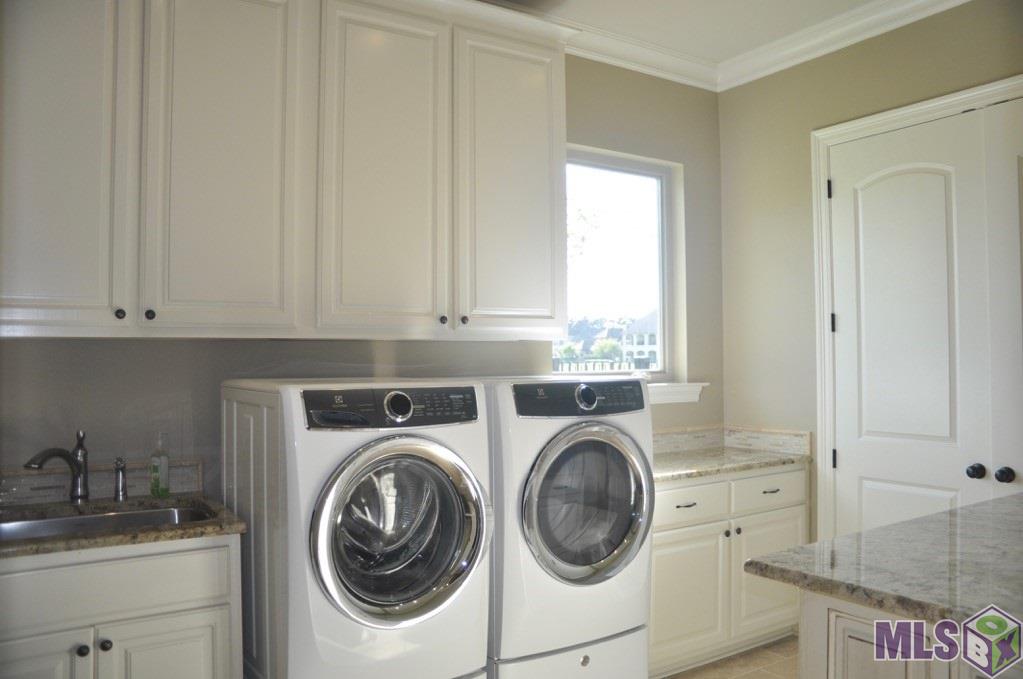 25837 Wax Road Denham Springs, LA 70726 - Photo 16 of 44 Large Laundry with sink and folding tables