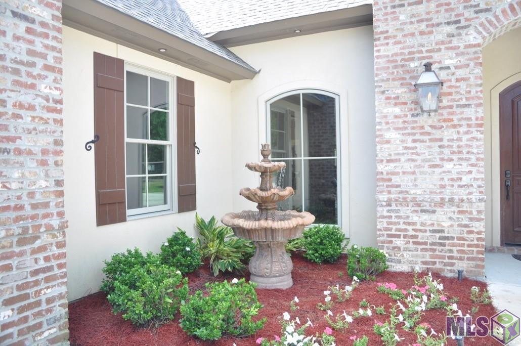 25837 Wax Road Denham Springs, LA 70726 - Photo 3 of 44 Fountain and beautiful landscaping