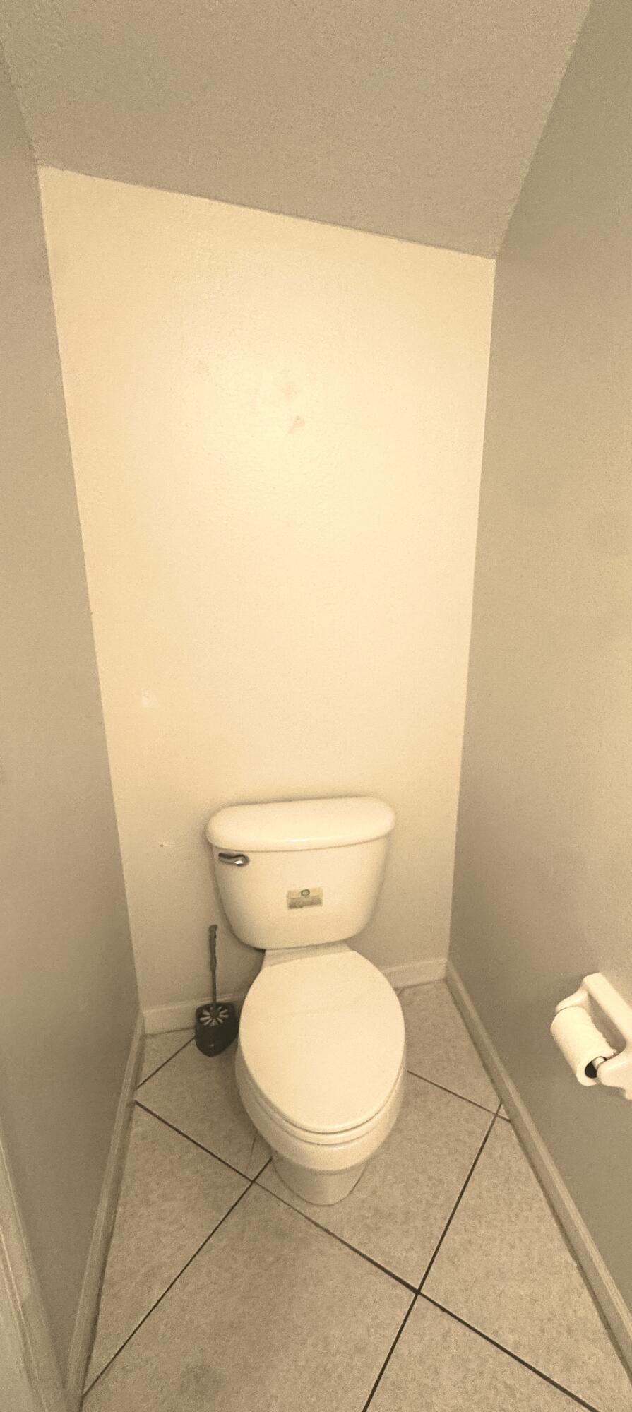 8171 Bellagio Lane Boynton Beach, FL 33472 - Photo 8 of 10 a white toilet sitting next to a white sink
