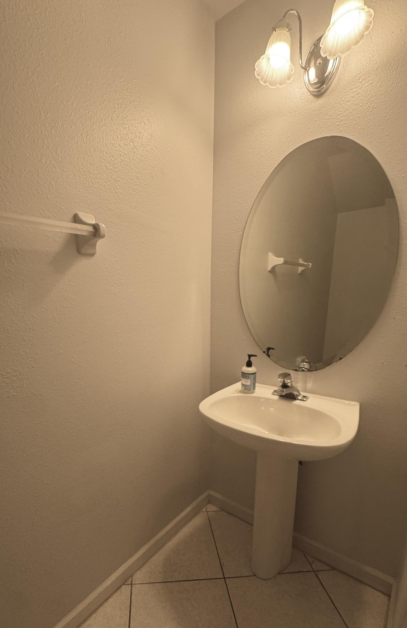 8171 Bellagio Lane Boynton Beach, FL 33472 - Photo 9 of 10 a bathroom with a sink a mirror and vanity