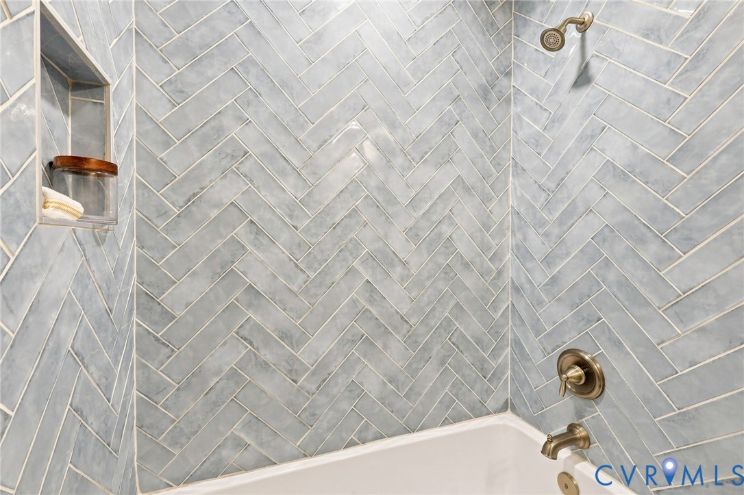 3221 Clintwood Road Midlothian, VA 23112 - Photo 27 of 46 Bathtub and shower combination featuring herringbo