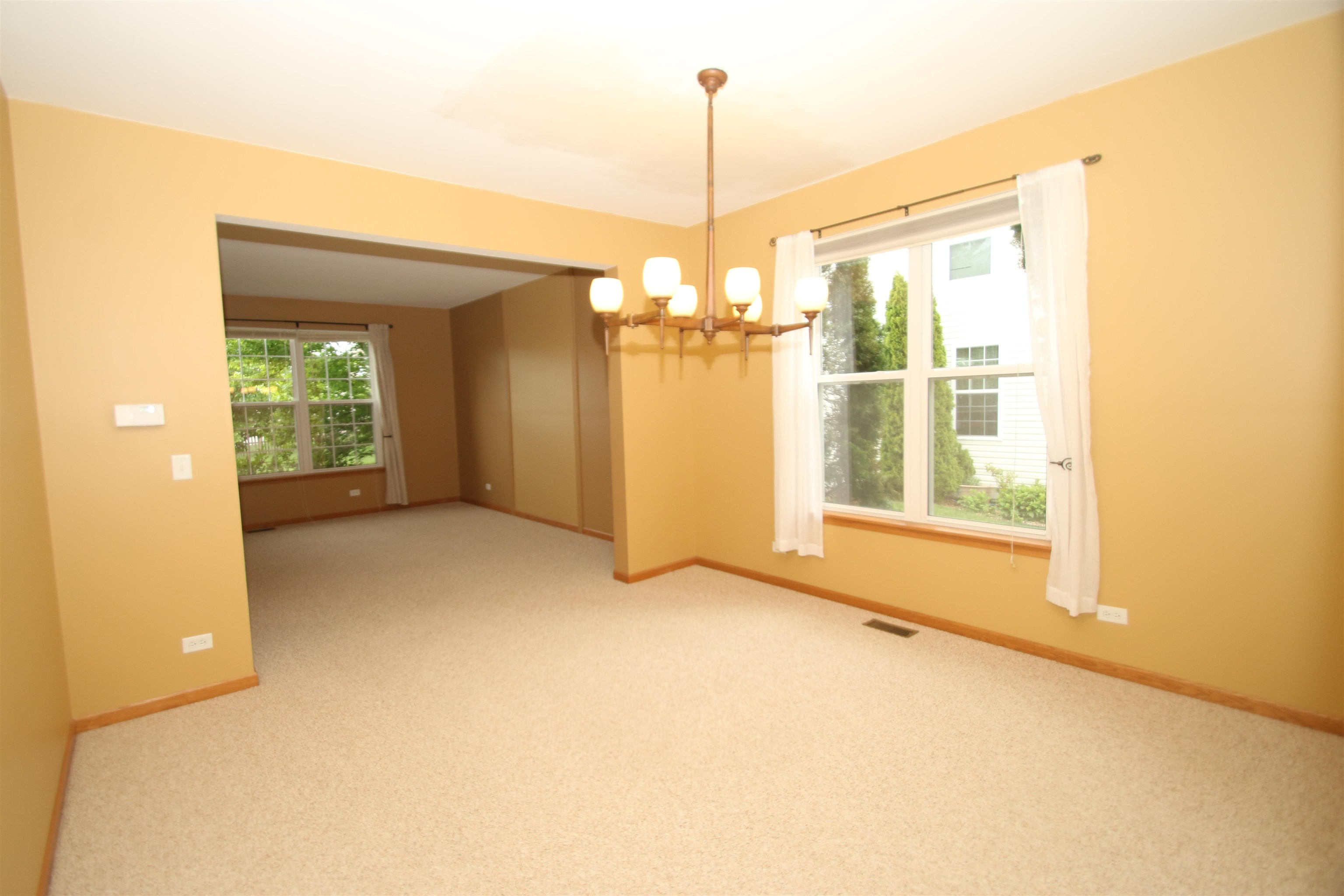 1340 Bailey Road Sycamore, IL 60178 - Photo 8 of 44 a view of a room with a windows and ceiling fan