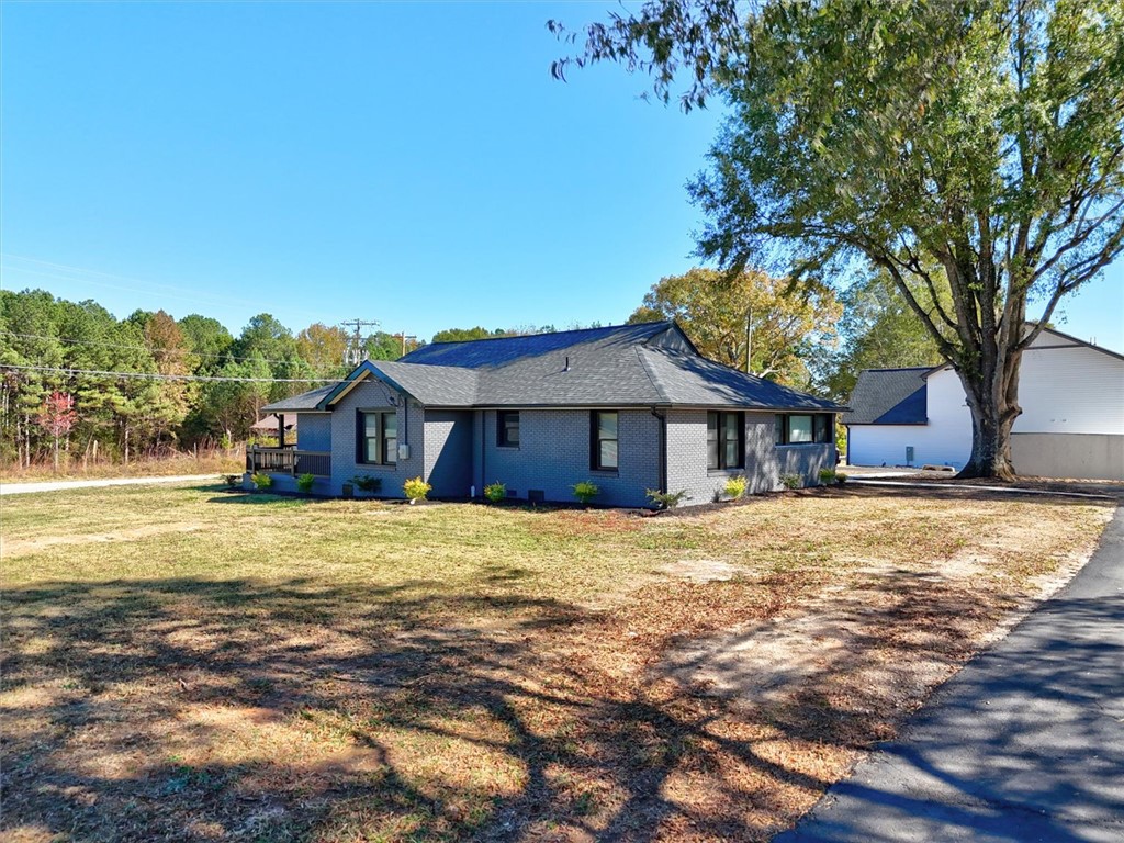 801 Cherokee Road Pelzer, SC 29669 - Photo 36 of 45 This charming home offers classic appeal with a durable brick exterior.