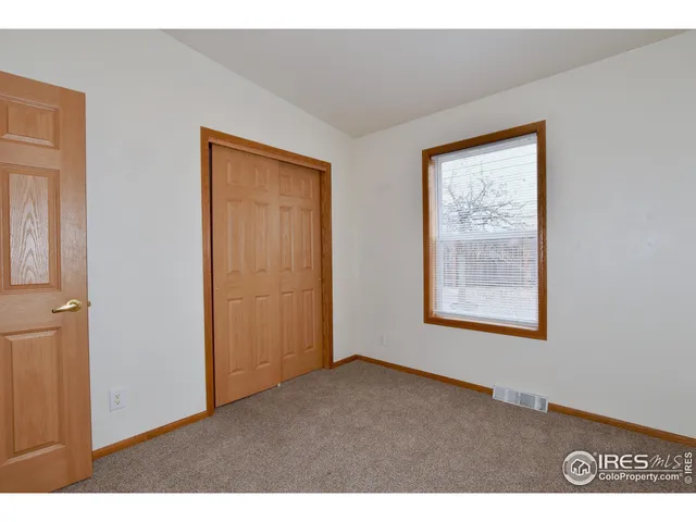 a big room with windows and closet