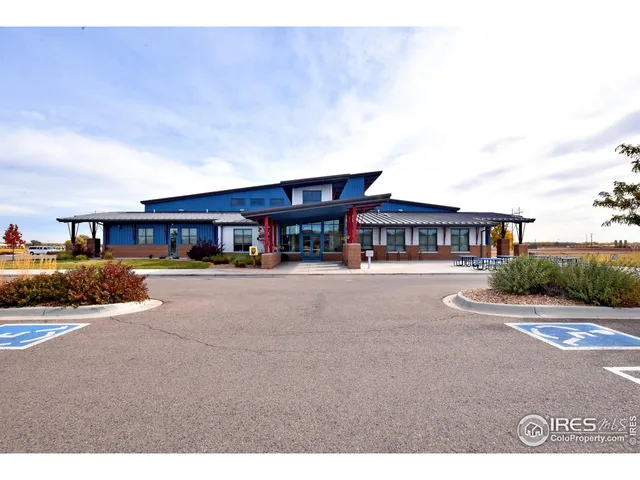 a view of a house with an outdoor space and seating area