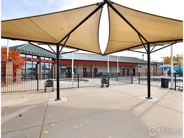 a front view of a building with parking space