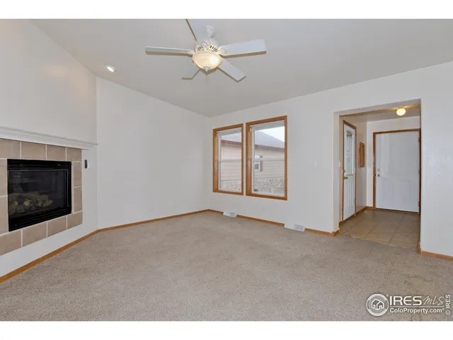 a view of an empty room with a fireplace
