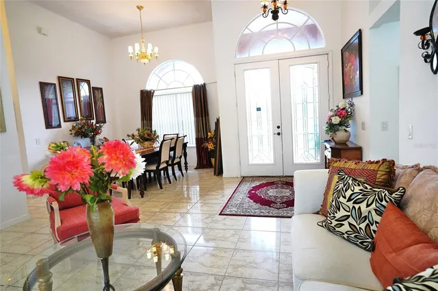 a living room with furniture a fireplace and a window