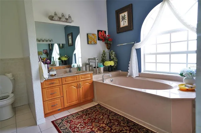 a utility room with sink dryer and washer