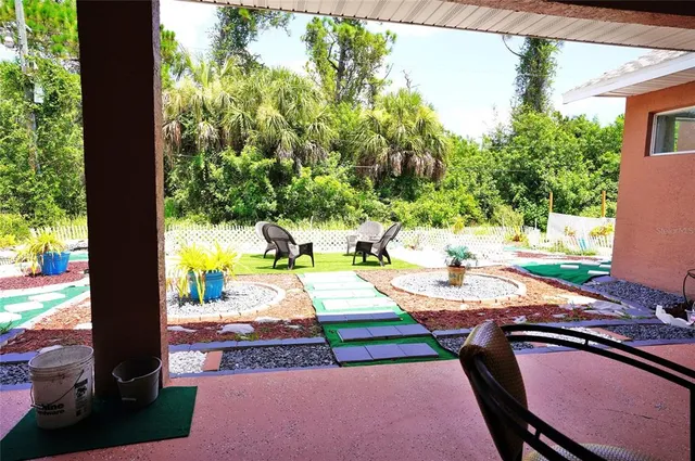 a aerial view of a house with backyard