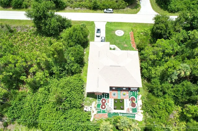 a view of a swimming pool with a table and chairs