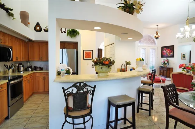 a kitchen with stainless steel appliances a sink stove and cabinets