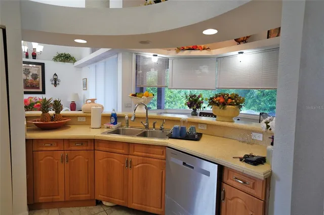 a living room with furniture and flowers