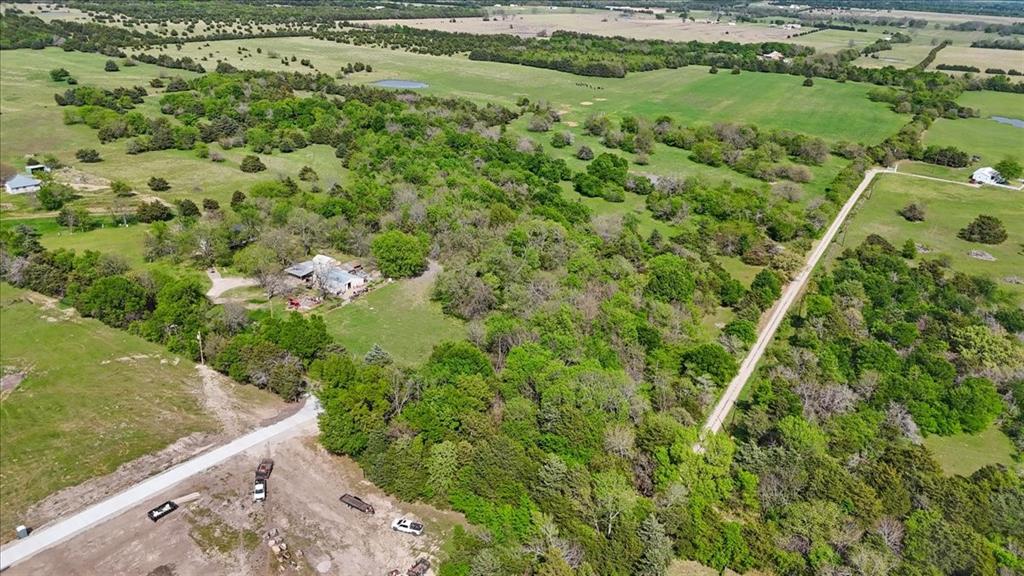 0 Cr 1037 Road Greenville, TX 75401 - Photo 17 of 20 a view of a big yard with lots of trees