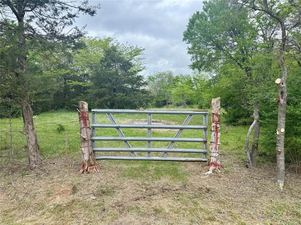 0 Cr 1037 Road Greenville, TX 75401 - Photo 3 of 20 a view of backyard with deck and a garden
